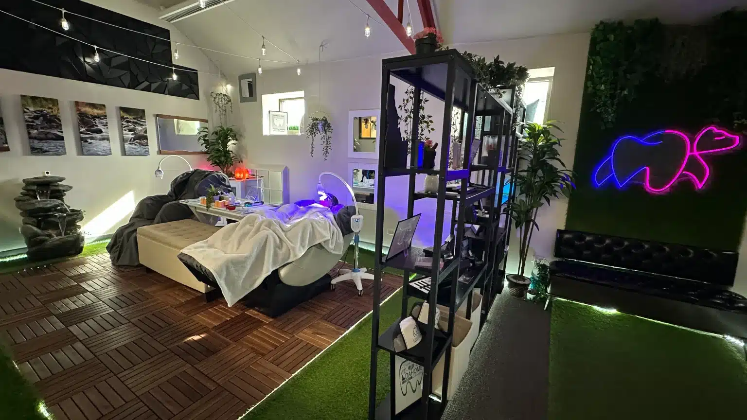 Teeth whitening in Boise at Idahome Smiles, a client relaxing under blue LED light in a zero-gravity chair inside the private spa retreat